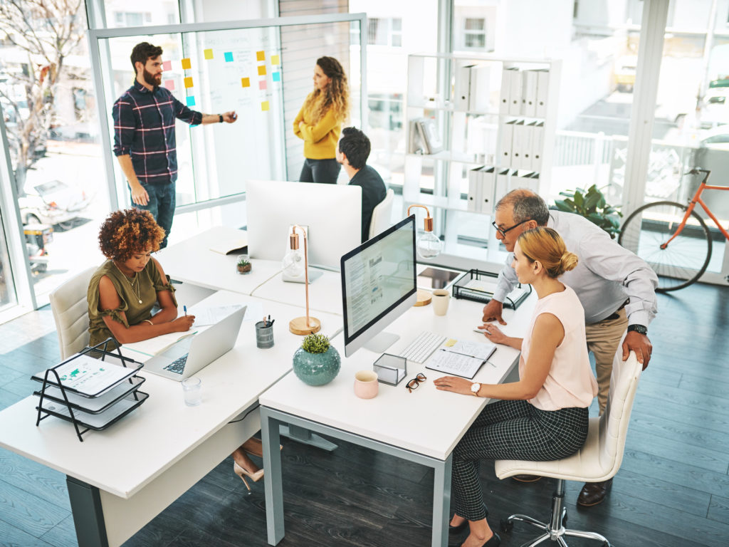 Individuals in Office Space with lots of Windows