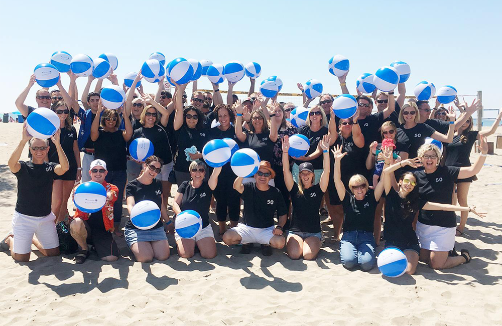 Group of team members at the beach.